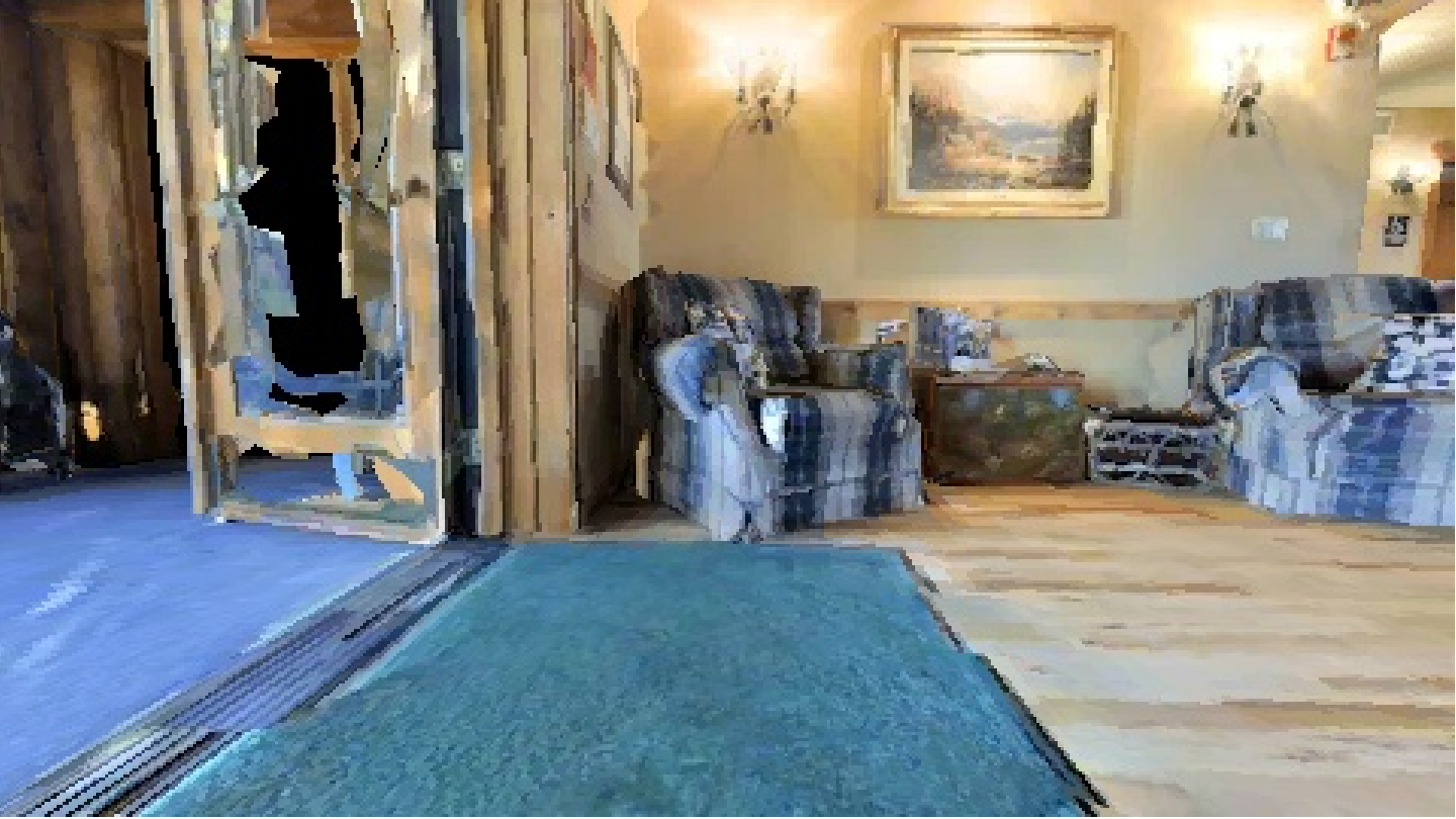 Simulated indoor RGB observation containing a referred armchair